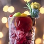 close up shot of holiday sangria with twinkling lights in the background