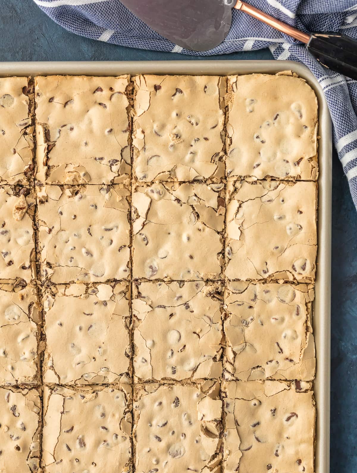 A baking pan filled with chocolate chip bars, but into large squares