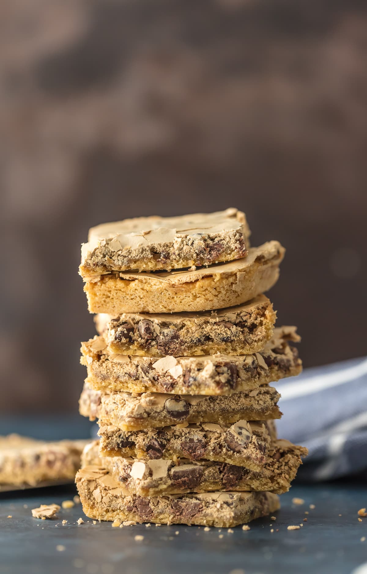 Chocolate Chip Cookie Bars are the ultimate holiday dessert! Baking amazing chocolate chip bars has never been easier or more delicious, and they're topped with a brown sugar meringue for even more flavor. The perfect Christmas dessert! Chocolate Chip Cookies Bars topped with brown sugar meringue