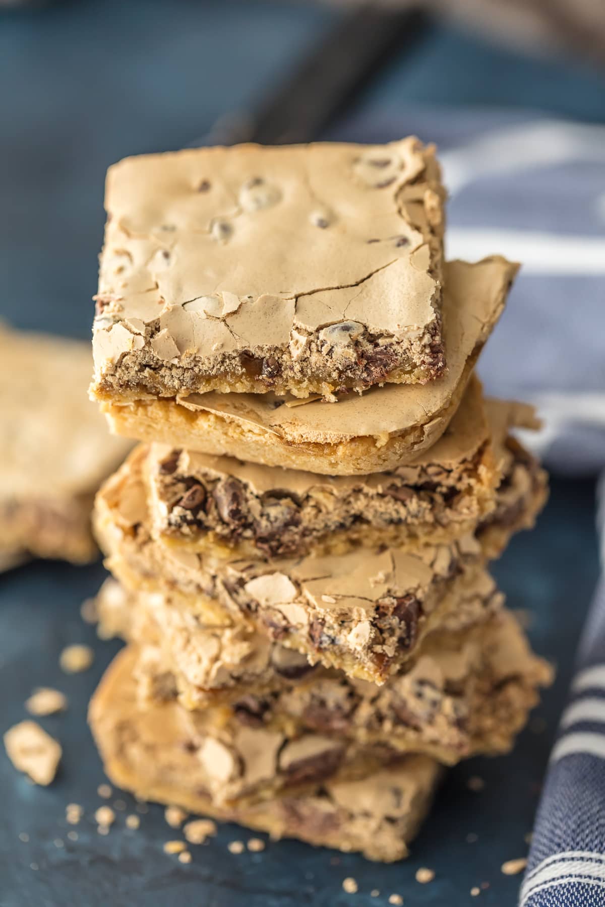 A stack of chocolate chip bars topped with meringue