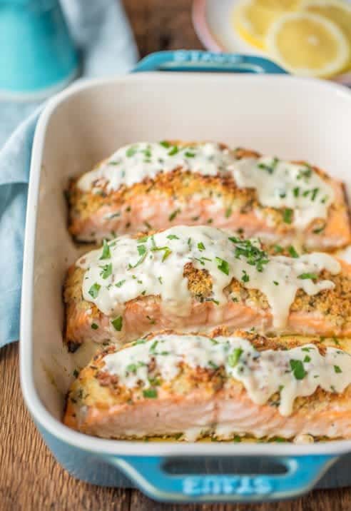 PARMESAN CRUSTED WHITE WINE DIJON SALMON is our very favorite way to enjoy seafood! Salmon coated with a crispy garlic parmesan crust and drenched in an amazing white wine dijon. TO DIE FOR!