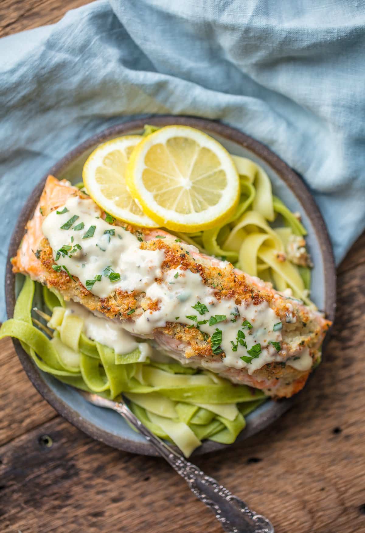 A plate of Parmesan Crusted salmon on a bed of pasta