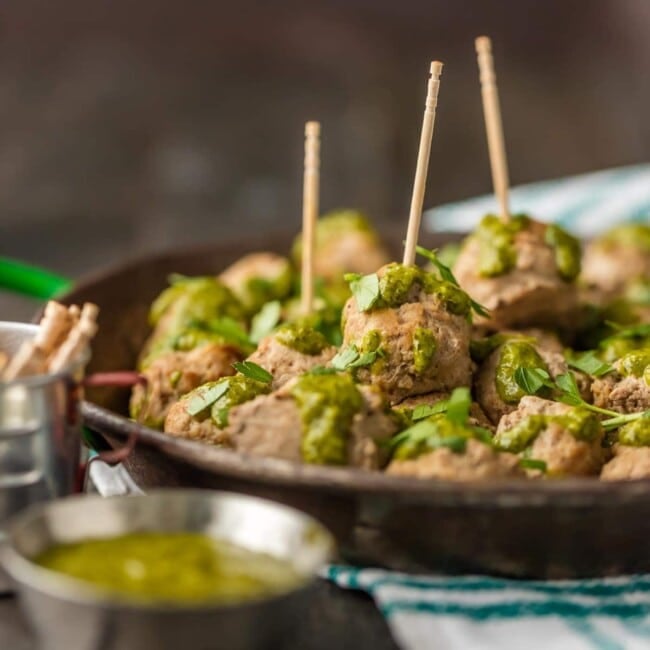 These PERUVIAN CHICKEN MEATBALLS WITH GREEN SAUCE are the perfect holiday or Super Bowl appetizer! The Peruvian green sauce, made with a parsley base, is just the right amount of spicy. The drop meatballs are just the right amount of easy.