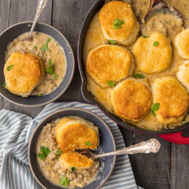 SAUSAGE BISCUIT GRAVY COBBLER is a delicious and easy one pan meal. This skillet breakfast recipe takes classic biscuits and gravy and makes it even better. This sausage and biscuits recipe has quickly become our very favorite Christmas morning breakfast and for good reason. Holiday comfort food at its finest!