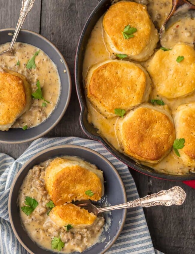 SAUSAGE BISCUIT GRAVY COBBLER is a delicious and easy one pan meal. This skillet breakfast recipe takes classic biscuits and gravy and makes it even better. This sausage and biscuits recipe has quickly become our very favorite Christmas morning breakfast and for good reason. Holiday comfort food at its finest!