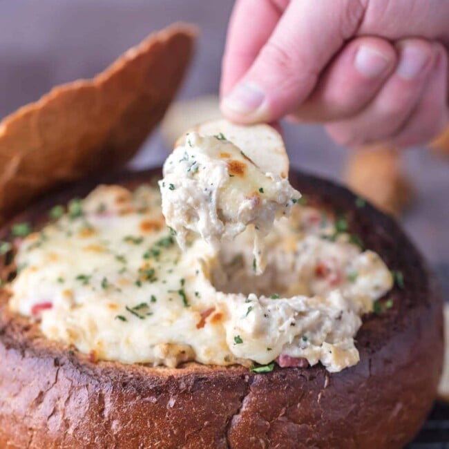 crab artichoke dip in bread bowl