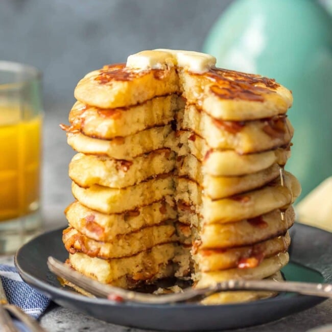 These BACON PANCAKES have been a family favorite for years! We first had these savory pancakes stuffed with bacon bits at the Calgary Stampede in Canada and have been making them ever since. The savory/sweet combo just can't be beat!