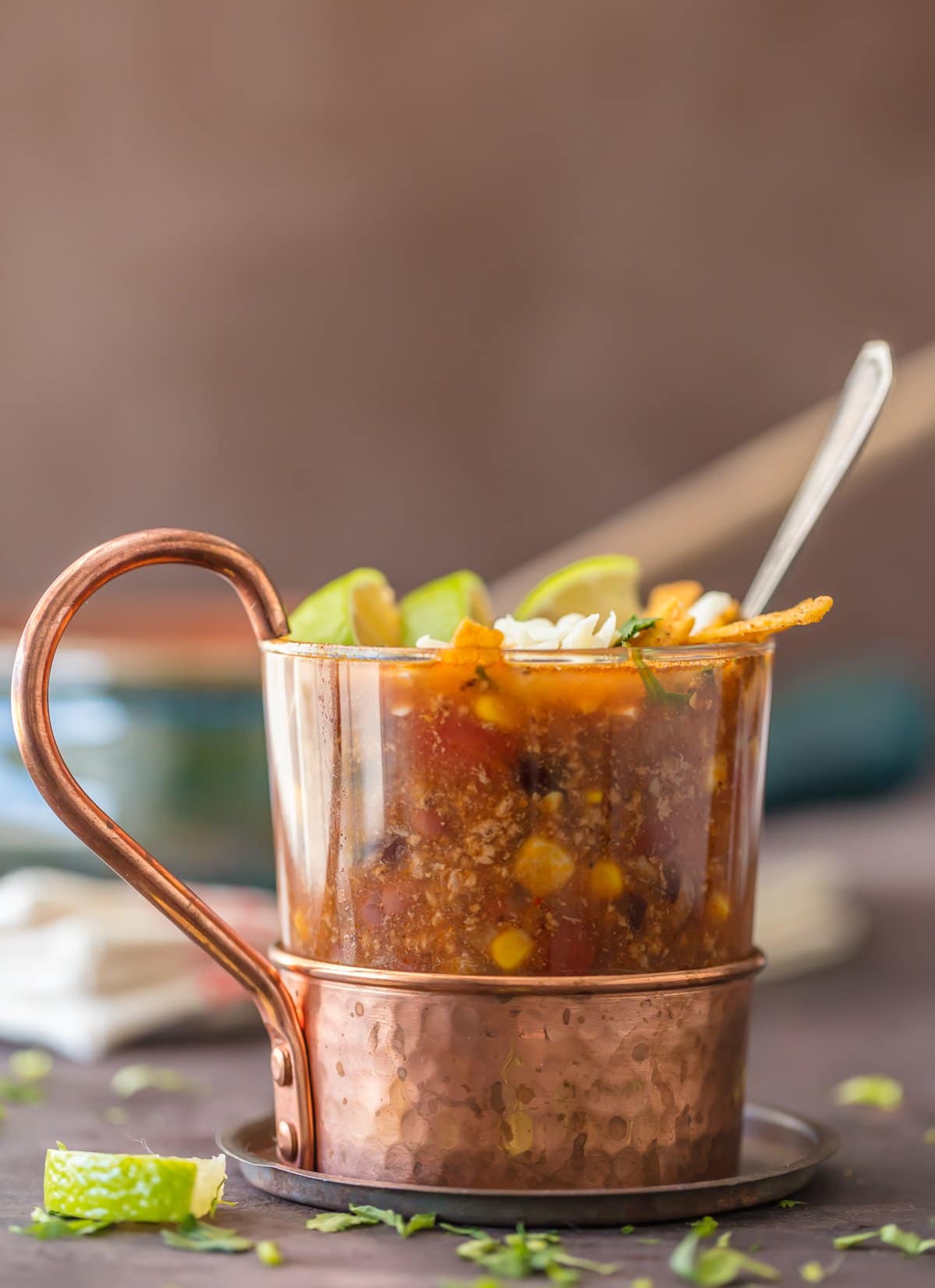 Easy beef tortilla soup topped with cheese and tortilla strips