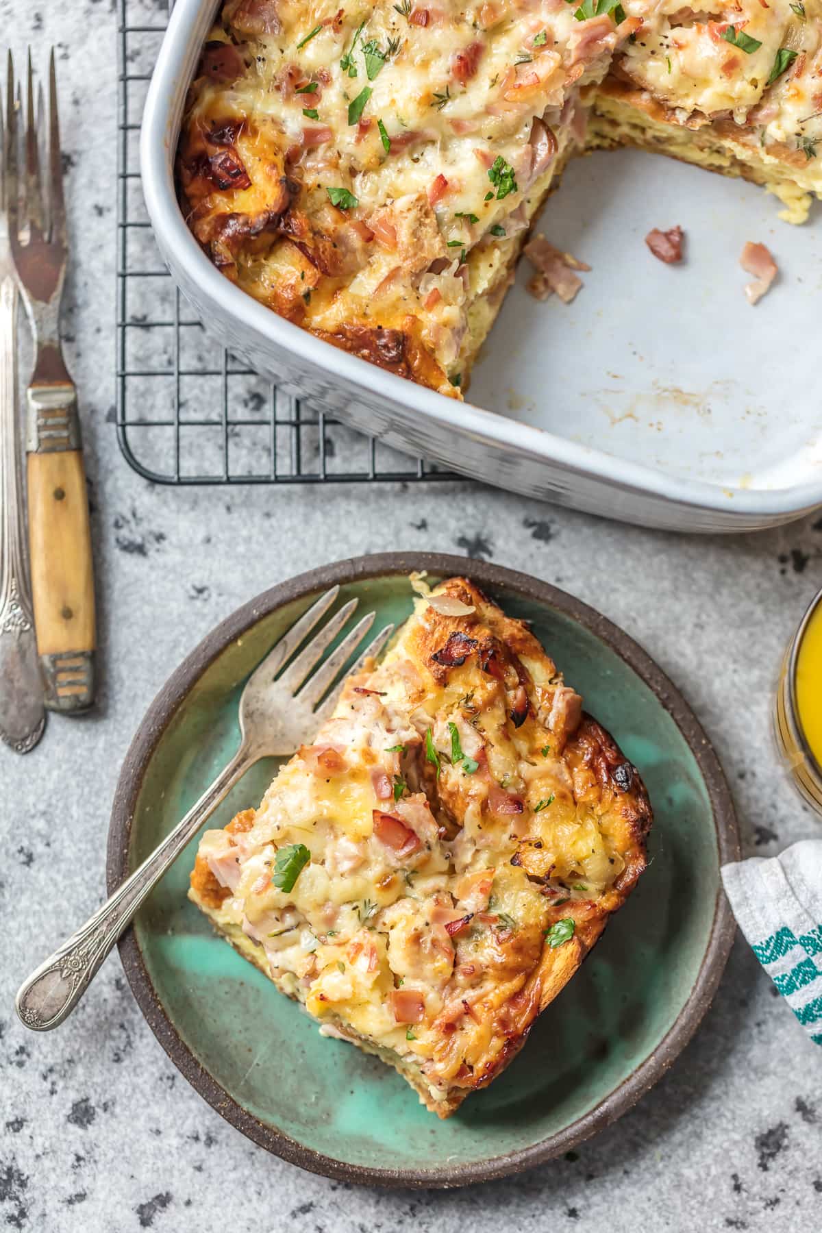 Egg ham and cheese casserole next to a plate of casserole