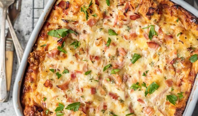 This HAM AND CHEESE BREAKFAST CASSEROLE is our favorite make ahead breakfast for any special occasion. Loaded with ham, cheese, , bread, eggs, herbs, and more! Sure to please everyone and just so easy to make!