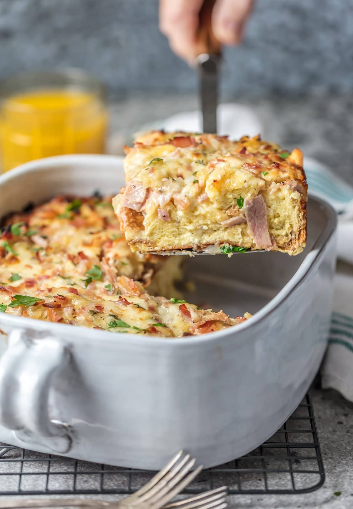 The perfect make ahead breakfast casserole with ham, egg, cheese, and herbs