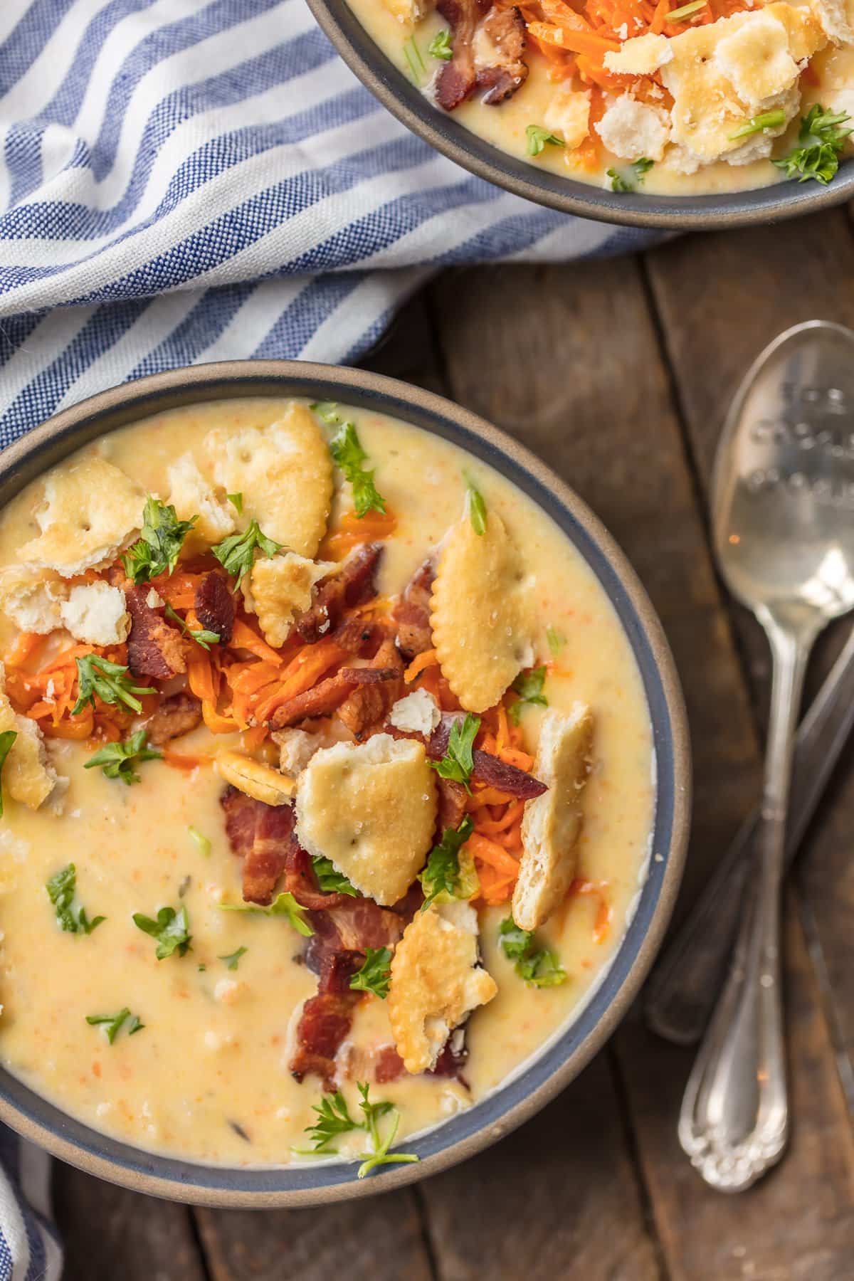 Hash Brown Potato Soup topped with carrots, bacon, and crackers