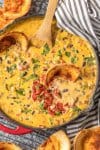 LOADED COWBOY QUESO is the ultimate Super Bowl dip! This EASY appetizer is loaded with velveeta, pepper jack, black beans, Rotel, and sausage! OUR FAVORITE TAILGATING DIP RECIPE!