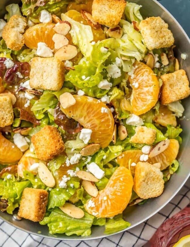 This MANDARIN ORANGE SALAD recipe with ALMONDS AND CIDER VINAIGRETTE has been a favorite in our family forever! My Mom always makes this amazing Mandarin Salad for family dinners and holidays.
