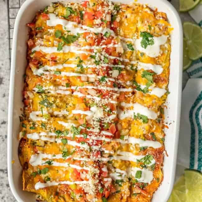 SALSA VERDE CHICKEN ENCHILADAS are a delicious and simple meal perfect for any occasion. They're stuffed with chicken, salsa verde, cheese, and topped with more sauce, cheese, onions, pico, and crema. The ultimate easy Mexican meal!