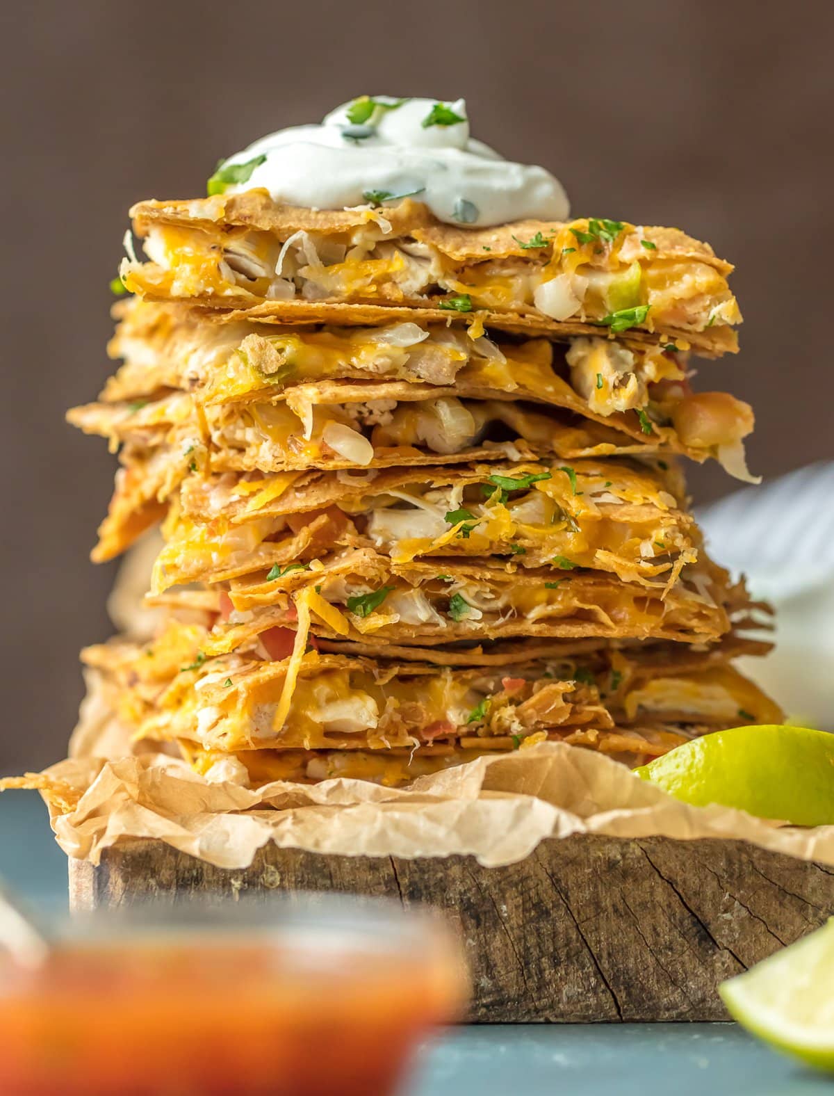 stack of quesadillas with a dollop of sour cream on top