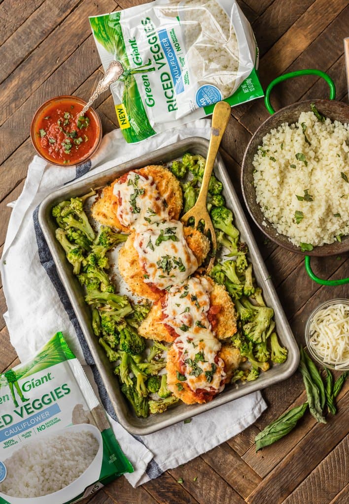 Easy chicken parmesan on a baking tray with roasted broccoli