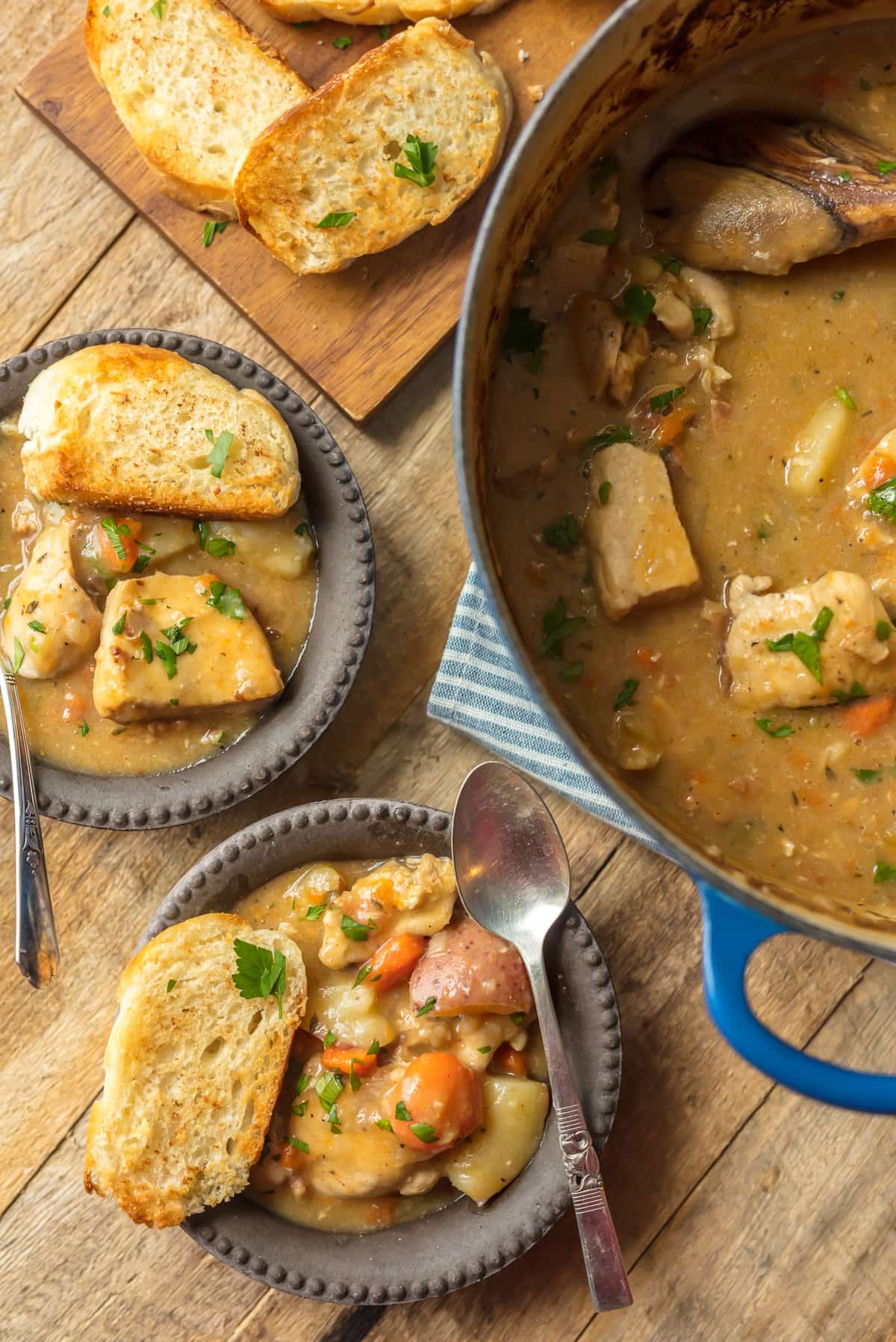 Bowls of chicken stew with crusty bread