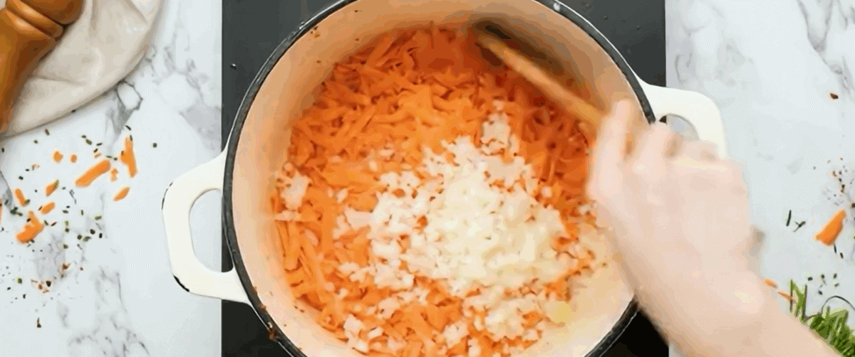 Cooking carrots and onions. 