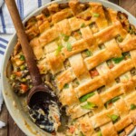 This crazy good CHICKEN POT PIE CASSEROLE is the ultimate easy comfort food! This AMAZING pot pie is loaded with carrots, peas, chicken, and topped with flakey pie crust. OBSESSED.