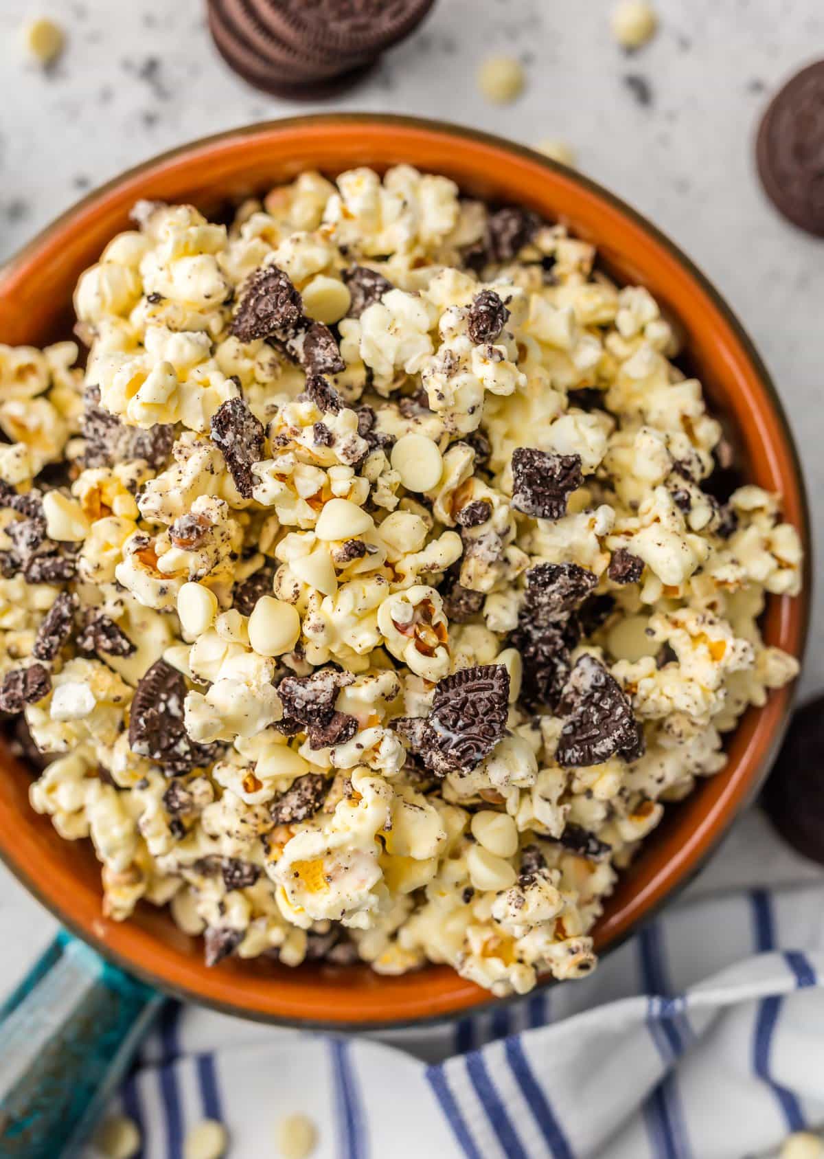 Sweet and salty popcorn recipe: a bowl of popcorn with Oreos and white chocolate chips