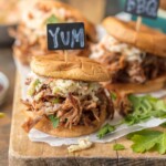 These SLOW COOKER BBQ PORK SANDWICHES are the ultimate fun finger food for any party! Use the meat for sliders, stuff them into quesadillas, or eat it over rice. The possibilities are endless!