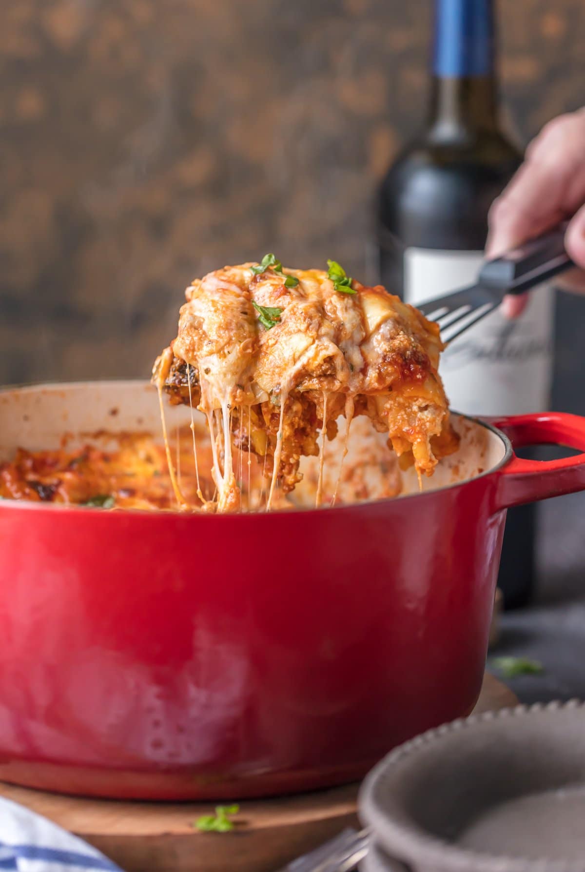 This Dutch Oven Lasagna recipe, or Stove Top Lasagna, will blow your mind! You'll never make a fully traditional lasagna recipe again after making this easy stove-top version. Best dutch oven recipe for lasagna