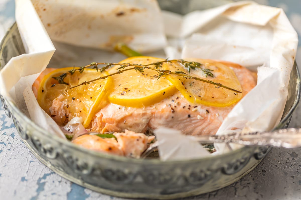 lemon butter salmon on top of parchment paper 