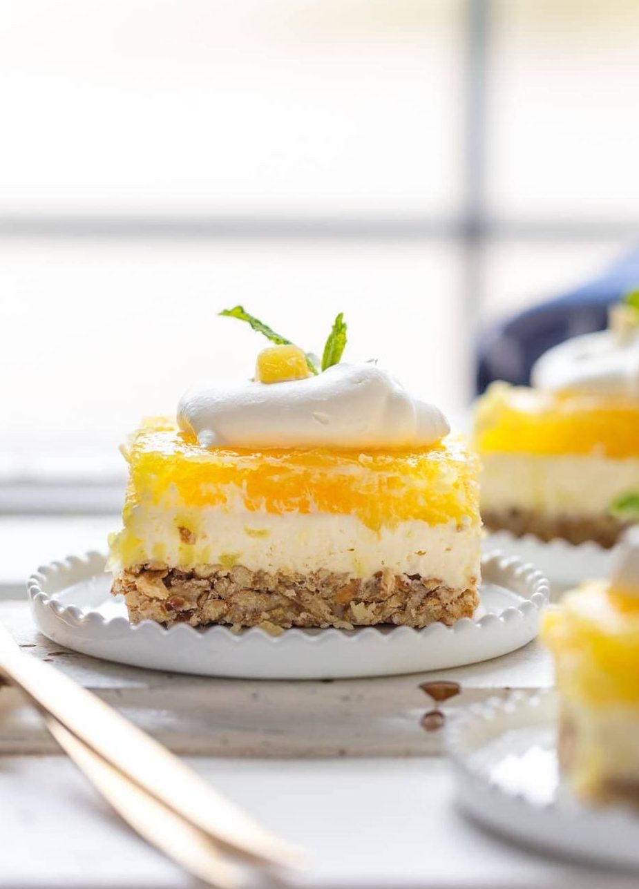 Pineapple Pretzel Salad is our go-to Pretzel Salad Recipe for Easter and Christmas! It is the perfect holiday side dish recipe! Wow your guests with this twist on classic Strawberry Pretzel Salad. This Pineapple Pretzel Salad Recipe is an absolutely delicious flavor combination. Pineapple Pretzel Salad