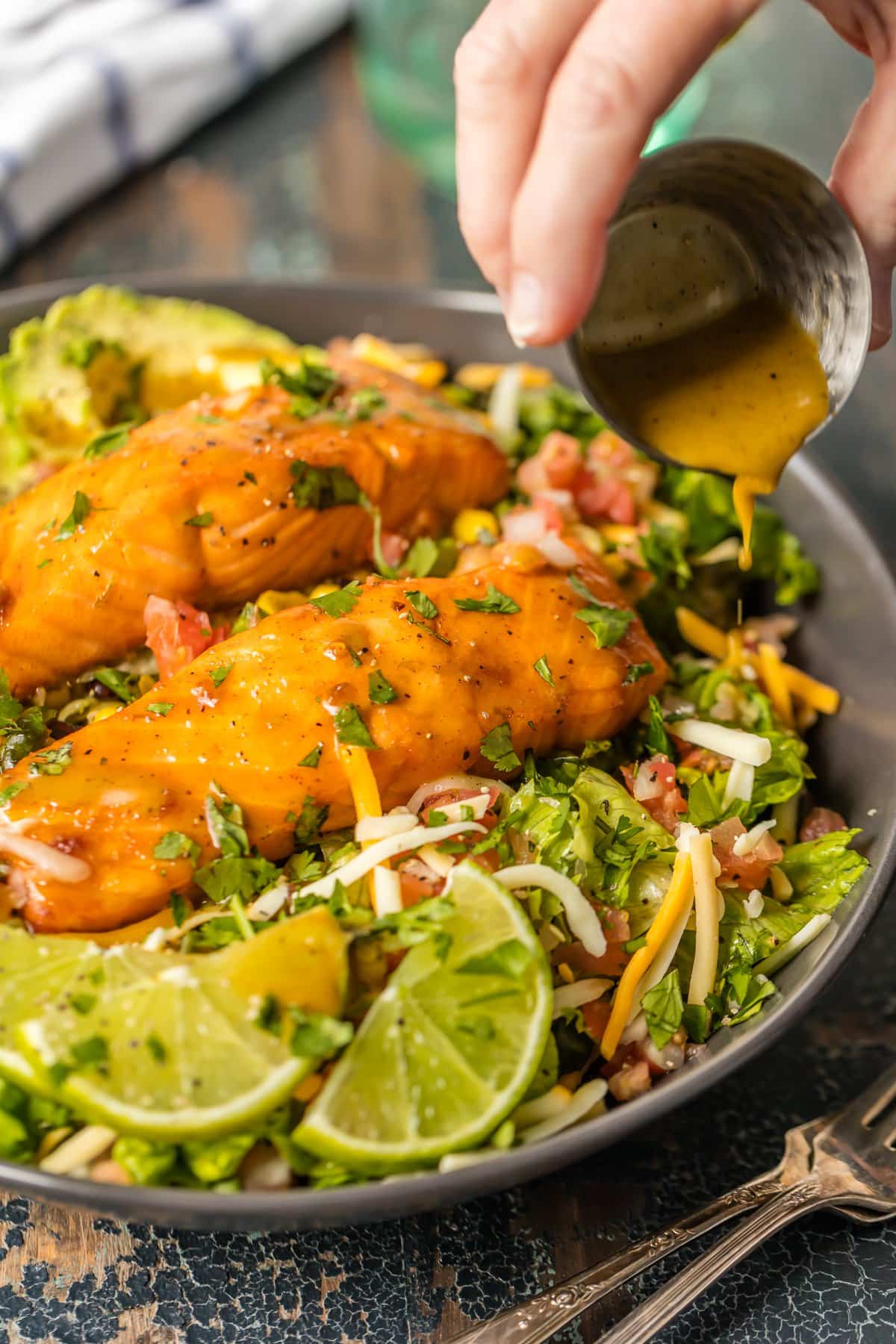 Salmon salad recipe with tomatoes, cheese, black beans, avocado, and more