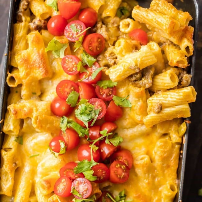 MEXICAN MAC AND CHEESE can't be beat! No need to fool with a tricky cheese sauce when you have this secret ingredient making things extra creamy and delicious. Spicy sausage and green chiles make this baked macaroni and cheese recipe soooo tasty!