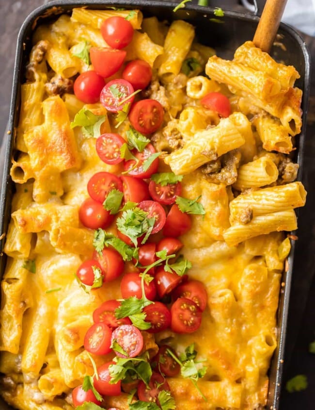 MEXICAN MAC AND CHEESE can't be beat! No need to fool with a tricky cheese sauce when you have this secret ingredient making things extra creamy and delicious. Spicy sausage and green chiles make this baked macaroni and cheese recipe soooo tasty!