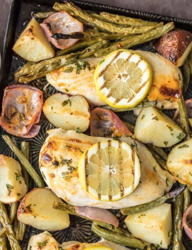 This ONE PAN CHILI LIME RANCH CHICKEN AND VEGETABLES is the absolute easiest healthy dinner recipe out there! Chili Lime Chicken, green beans, potatoes, and onion, tossed in ranch & cooked on one sheet pan.