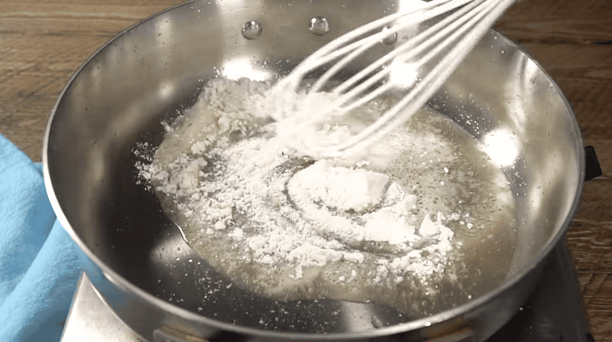 whisking butter and flour in a stainless skillet.