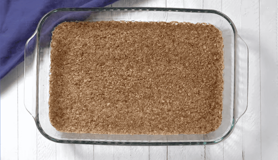 Pretzel crust in a baking dish.