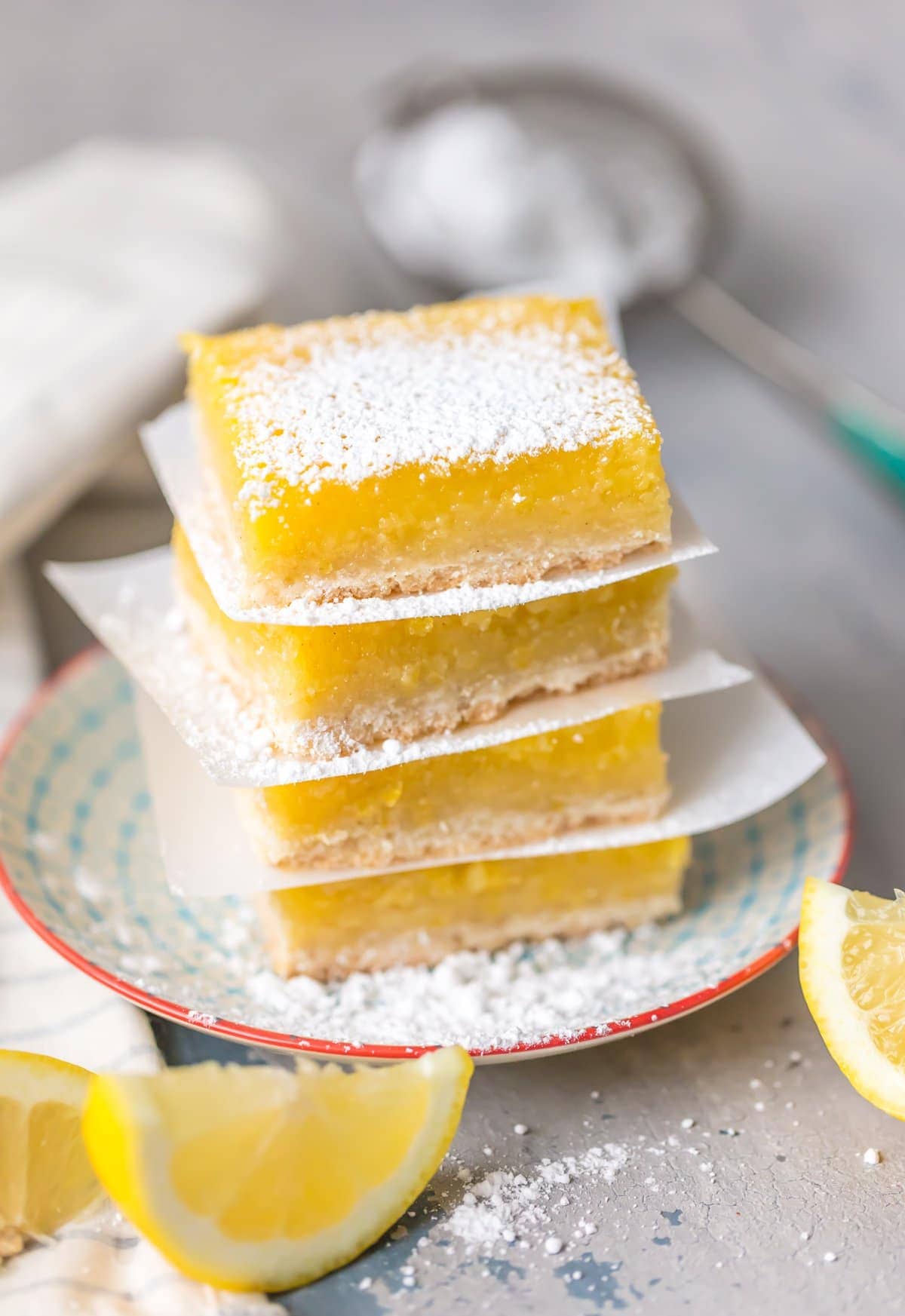 stacked lemon squares with powdered sugar