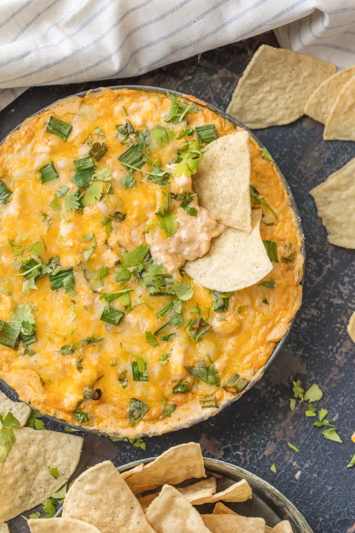Cheesy chicken enchilada dip topped with green chiles
