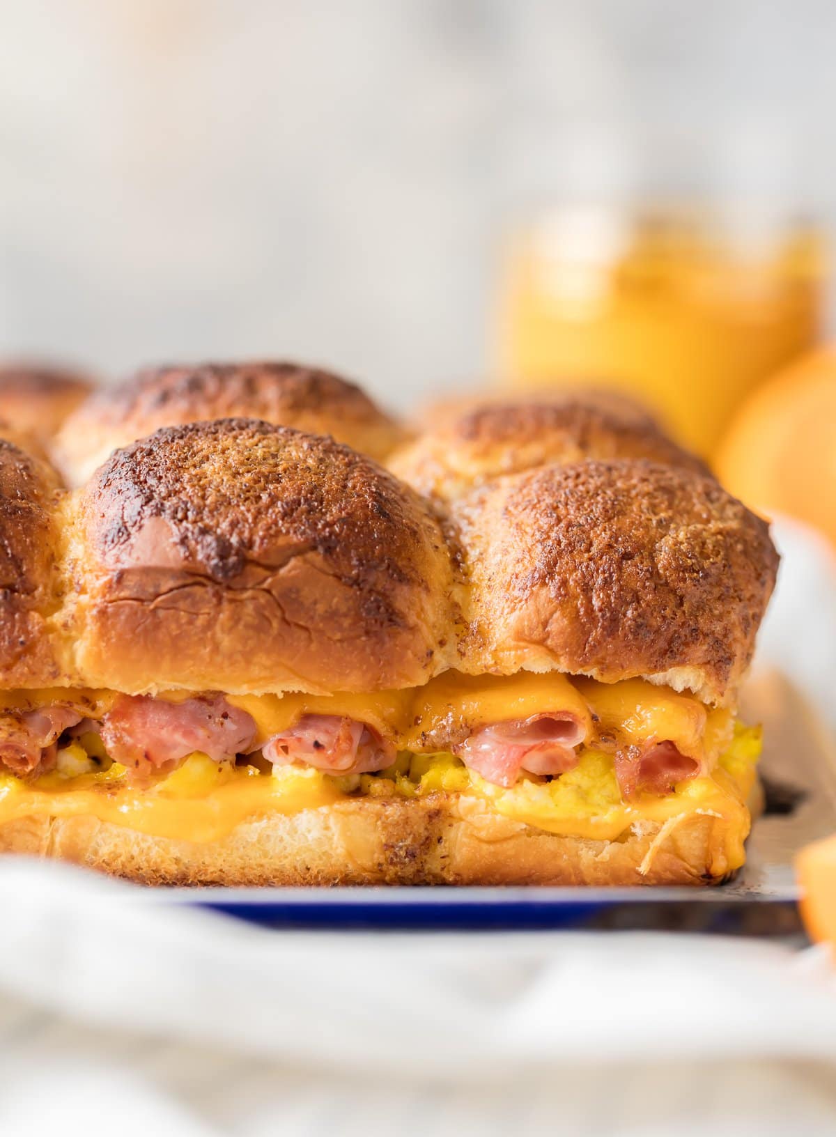 Baked breakfast sliders filled with ham, egg, and cheese