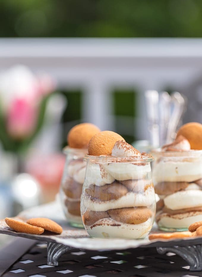 These Easy Tiramisu Cups are made with a secret ingredient, vanilla wafers! These desserts made with Nilla Wafers dipped in coffee, then layered with mascarpone mousse and topped with cocoa powder, make for the cutest mini treats, just begging to make an appearance at your next BBQ! 