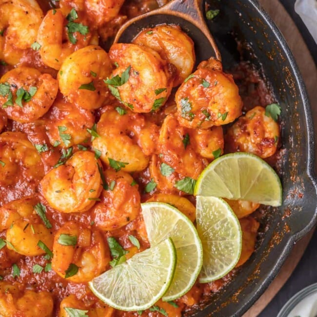 chipotle shrimp in skillet with wooden spoon