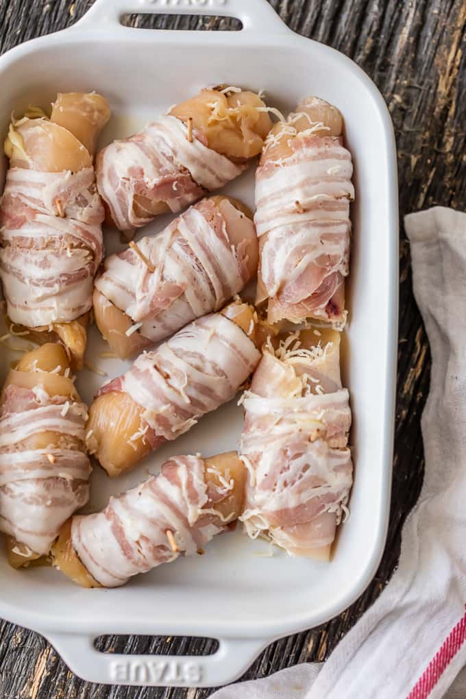 Chicken breast wrapped in pancetta in a baking pan
