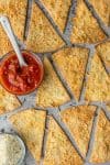 Homemade Tortilla Chips with Garlic Parmesan are a delicious and easy snack you can bake for Cinco de Mayo! It's so easy to make these Baked Tortilla Chips, and they're healthier and tastier than store bought! They're the easiest and most flavorful way to elevate chips and salsa.