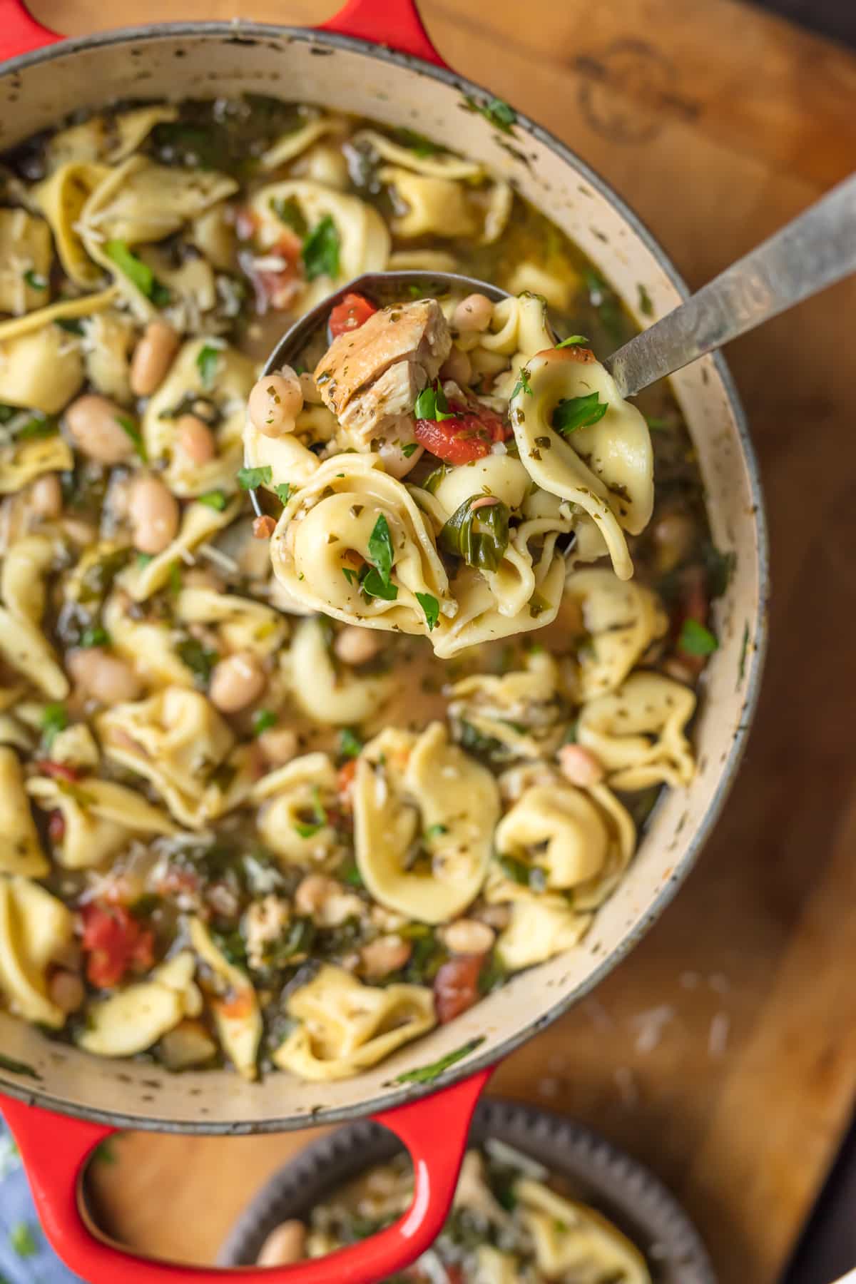 Chicken and Pesto Tortellini Soup in large red pot