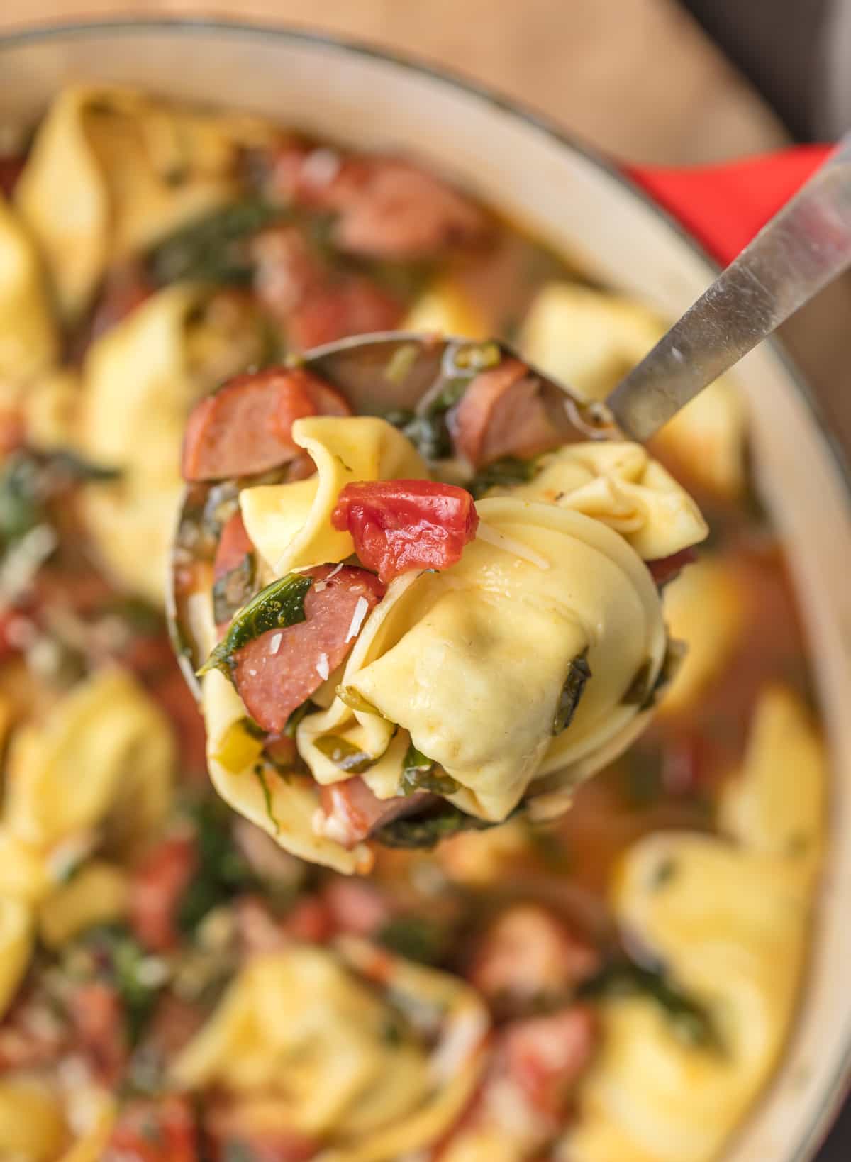 Close up of Sausage Tortellini Soup on a ladle