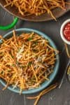 Shoestring Fries are the perfect side for sandwiches to bbq to so much more! We love these fun Shoestring Potatoes that are super thin and deep fried. They're crispy, customizable, and delicious. Once we show you how to make shoestring fries you'll never make fries the same way again. We love to make ours Garlic Parmesan Fries! So delicious and fun.