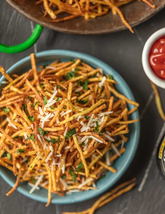 a bowl of shoestring fries