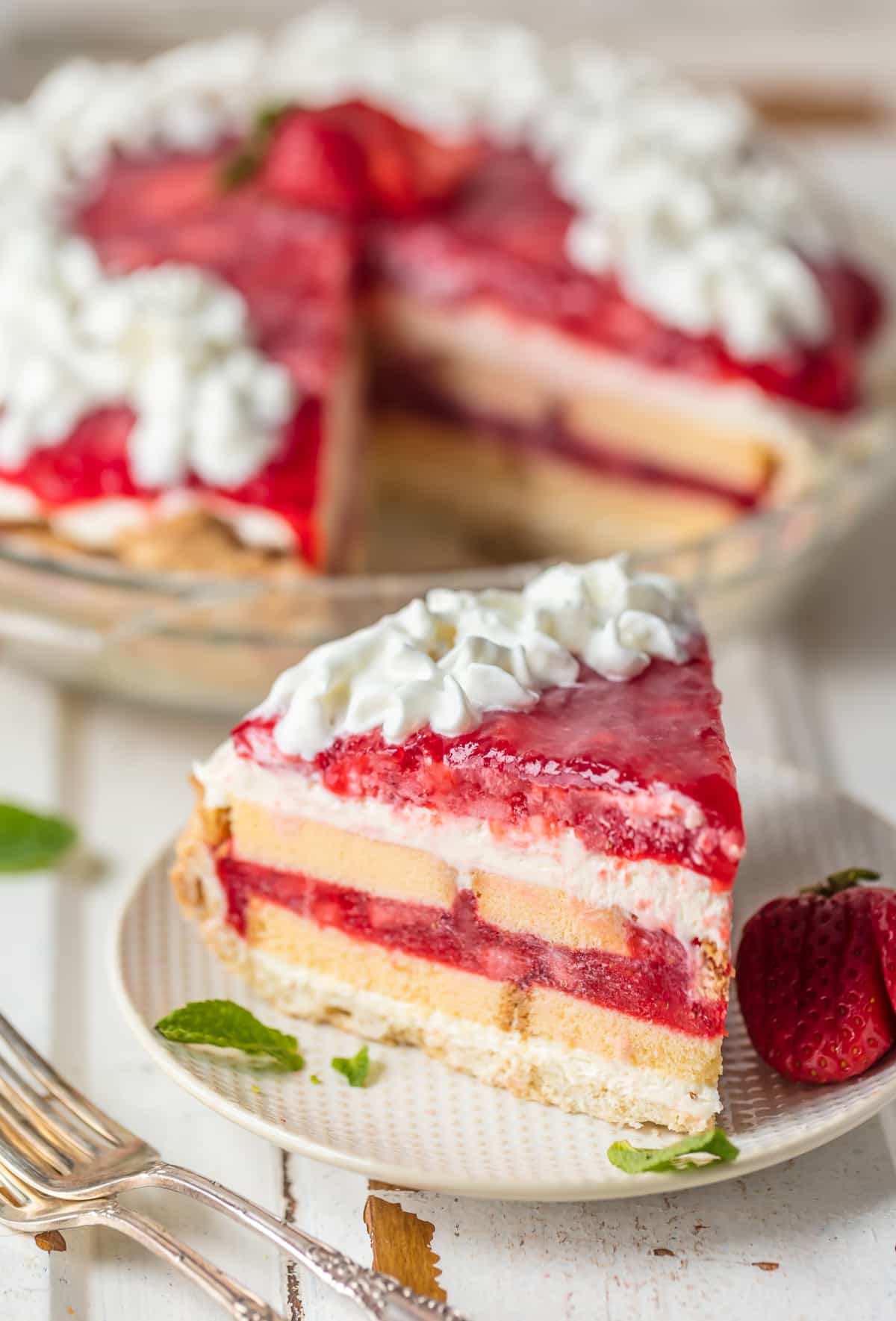 Strawberry Shortcake pie: layers of pie crust, pound cake, cream cheese filling, and strawberry glaze
