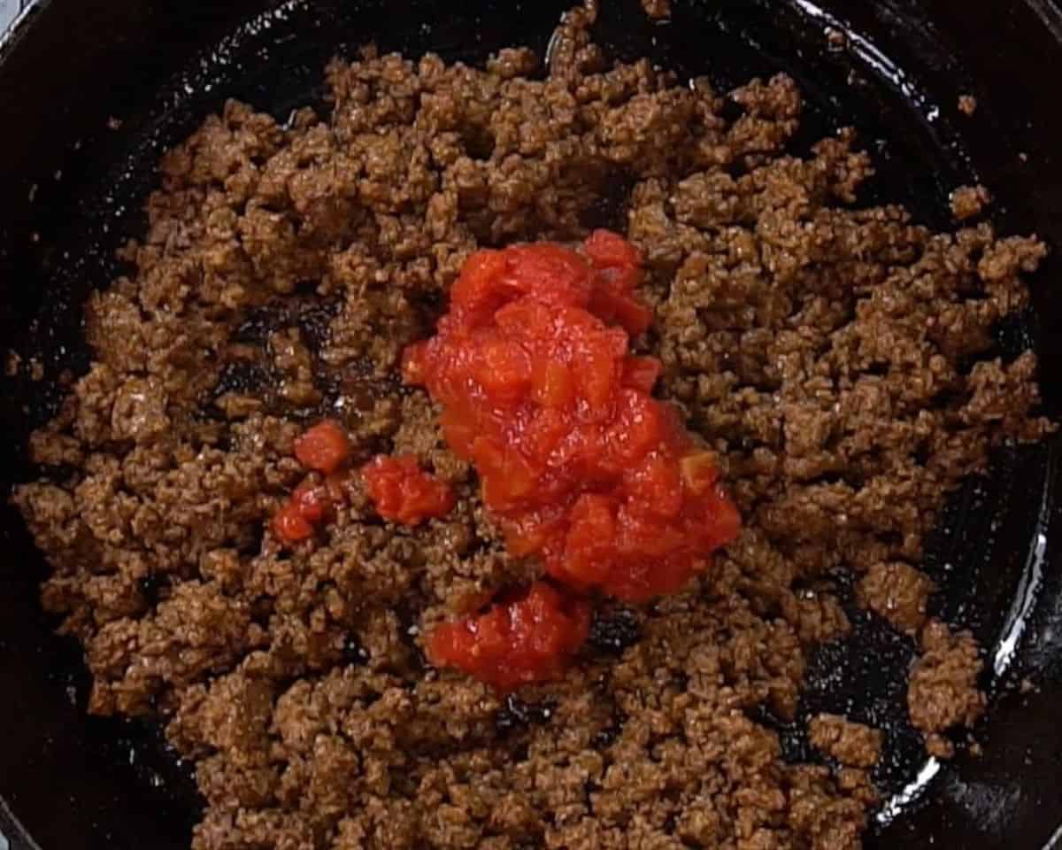 Cooking the ground beef.
