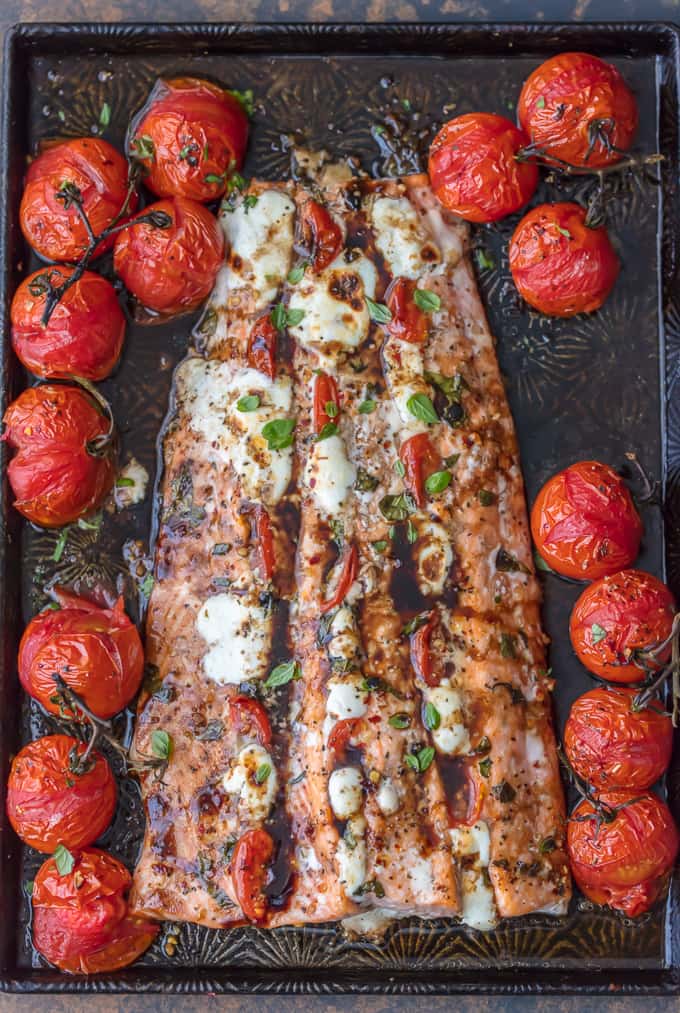 COOKBOOK PHOTOGRAPHER This CAPRESE STUFFED SALMON with BALSAMIC ROASTED TOMATOES will be your new favorite sheet pan dinner! This easy one dish salmon meal is loaded with flavor and oh so easy. Sure to please!