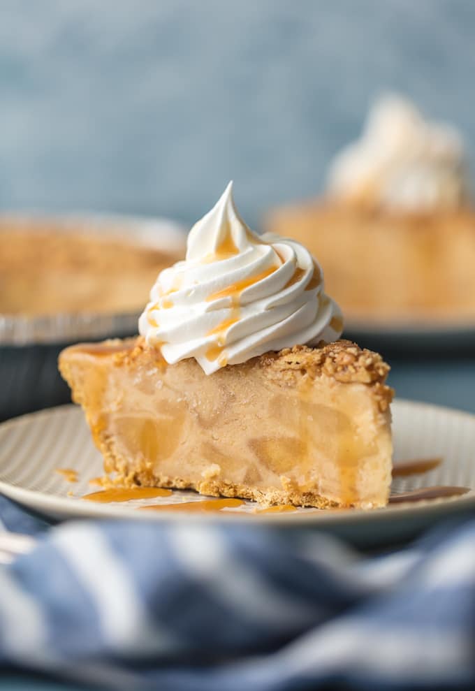pie with whipped cream and caramel drizzle on plate